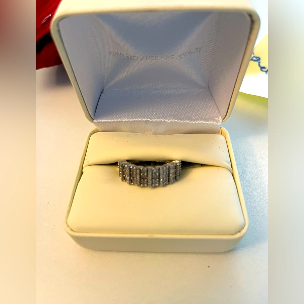 Genuine Diamond ring set in pure sterling silver. Silver size 8.